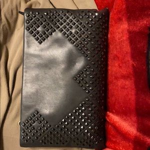 Black clutch purse. Shoulder/wrist strap.